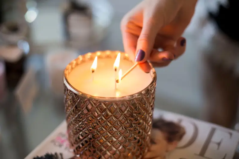 Candle being lit with a match.