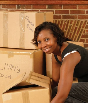 women with moving boxes