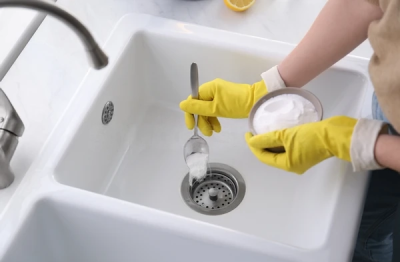 Adding baking soda to clean a kitchen sink drain