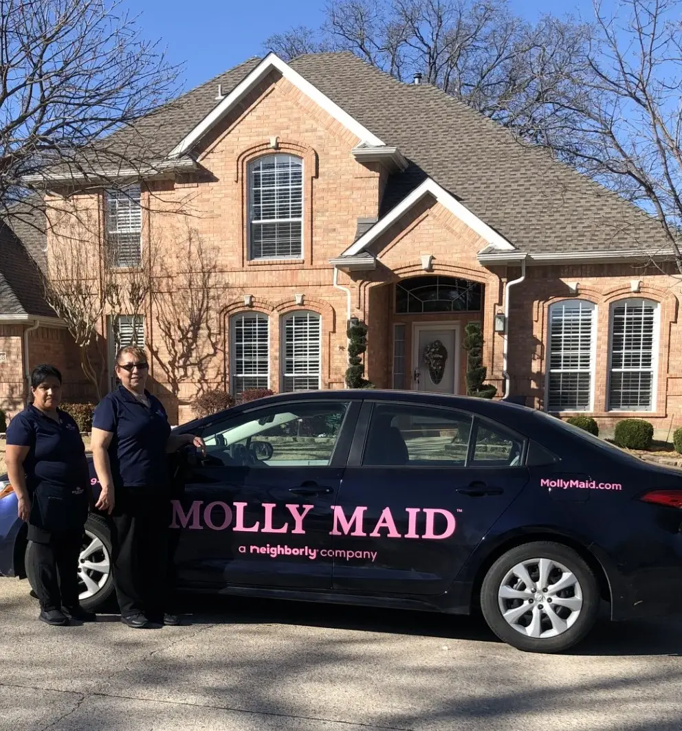 Molly Maid house cleaners standing outside of home in Flower Mound, TX.