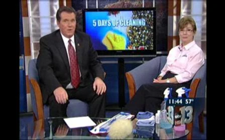 Two local ABC News anchors sitting in blue chairs on news set in front of TV screen that says '5 Days of Cleaning'