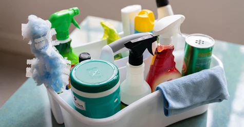 white cleaning caddy with cleaning products