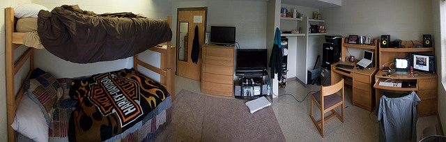 Panoramic view of a dorm room, with bunk beds, two TVs, and two desks. Photo Cred: Matt Witmer on Flickr.