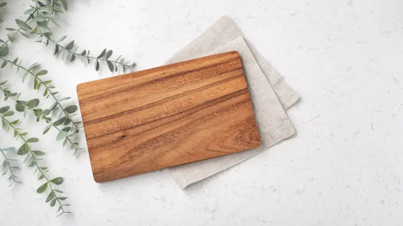 Wood cutting board on granite counter