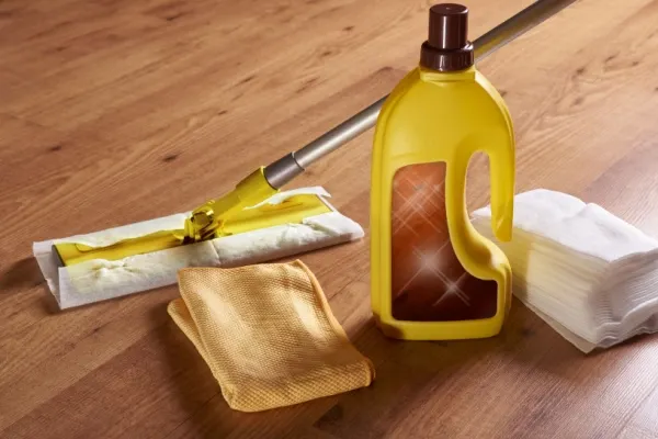 Mop, rags, and cleaning supplies for wood floors