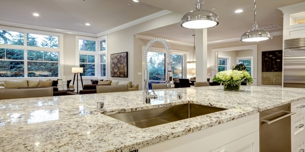 Clean modern kitchen with sparkling granite countertops.