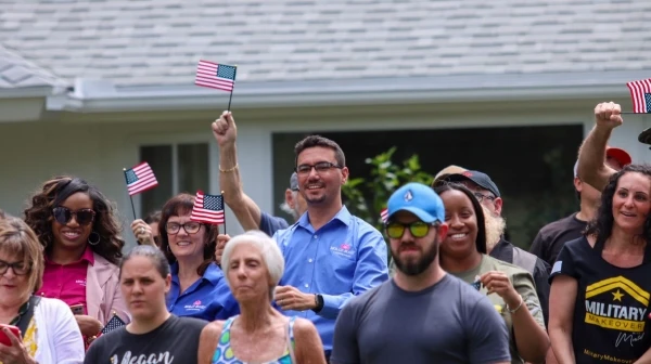 people waving the US flag