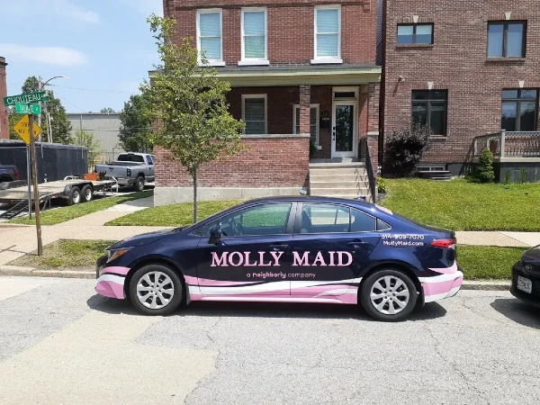 Molly Maid care in front of a residence.